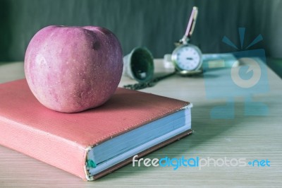 Apple And The Book Stock Photo