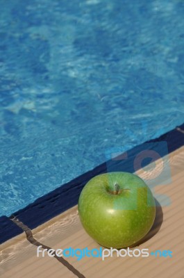 Apple At The Pool Stock Photo