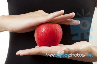 Apple In Hand Stock Photo