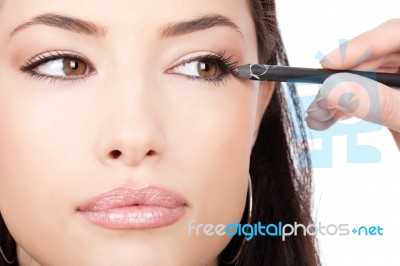 Applying Cosmetic Pencil Stock Photo