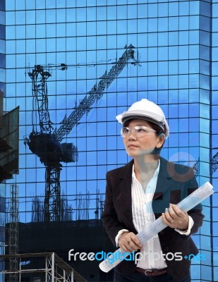 Architect Female And Plan Project On Working Site Stock Photo