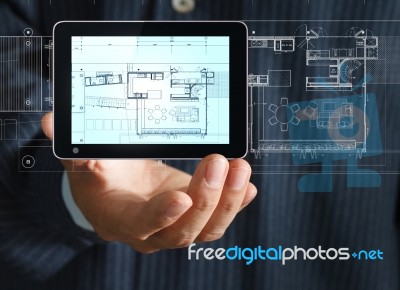 Architect Presenting Lay Out Plan Stock Photo