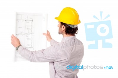 Architect Reviewing Building Plan Stock Photo