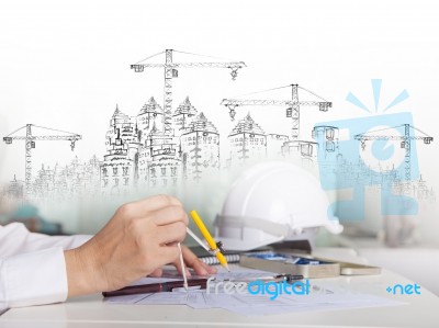 Architect Working On Talbe With Sketching And Building Construct… Stock Photo