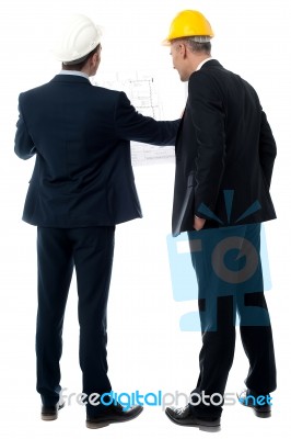 Architects Discussing Their Building Plan Stock Photo