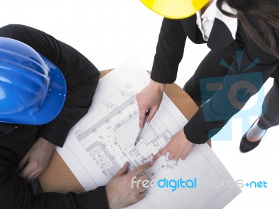 Architects discussing with plan Stock Photo