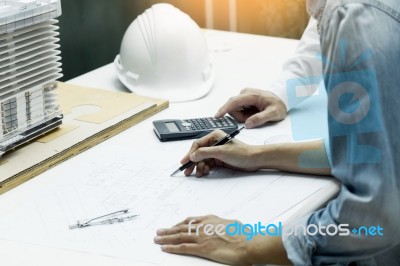 Architects Engineer Discussing At The Table With Blueprint - Clo… Stock Photo