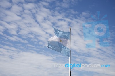 Argentina Flag On Blue Sky Stock Photo
