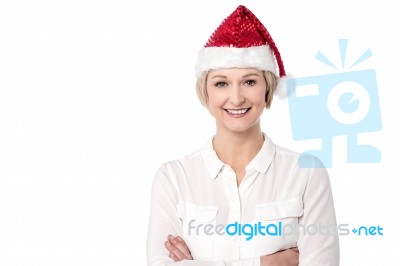 Arms Crossed Cheerful Lady Wearing Santa Cap Stock Photo