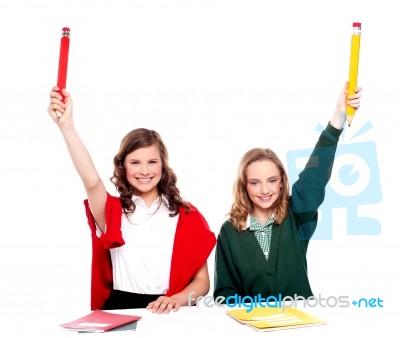 Arms Raised Girls Holding Pencil Stock Photo
