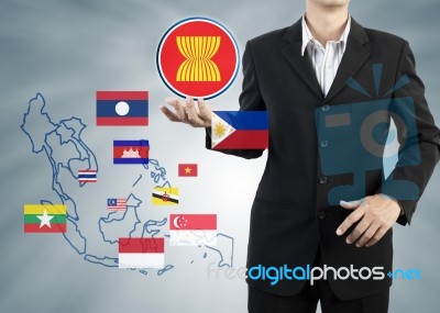 Asean Economic Community In Businessman Hand Stock Photo