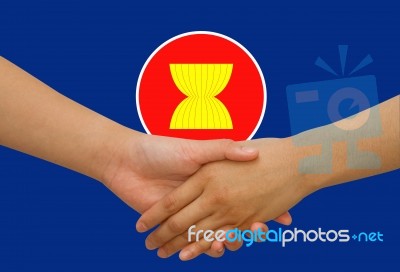 Asean Economic Community In Businessman Handshake Stock Photo