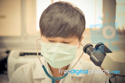 Asia Scientist Working In Biological Laboratory Stock Photo