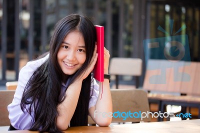 Asia Thai High School Student Uniform Beautiful Girl Read A Book… Stock Photo