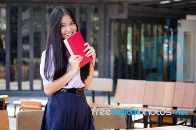 Asia Thai High School Student Uniform Beautiful Girl Read A Book… Stock Photo