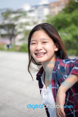 Asia Thai Teenager Women Scotch T-shirt Relax And Smile Stock Photo