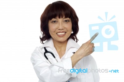 Asian Doctor Pointing Up gesture Stock Photo