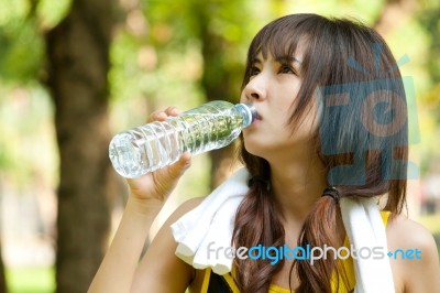 Asian Girl Drinking Water Stock Photo