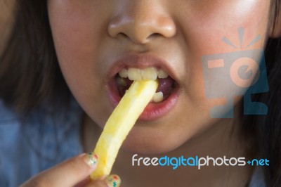 Asian Girl Eating French Fries Stock Photo Asian Girl Eating French Fries Stock Photo