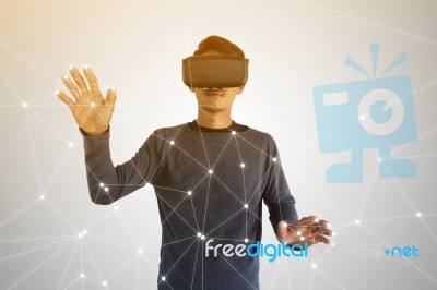 Asian Man Wearing Virtual Reality Glasses  Stock Photo
