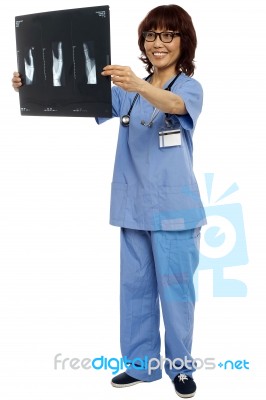 Asian Surgeon Showing Xray Report Stock Photo