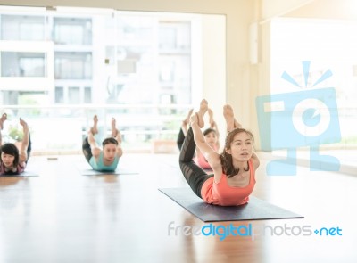 Asian Woman Doing Yoga Indoors Stock Photo