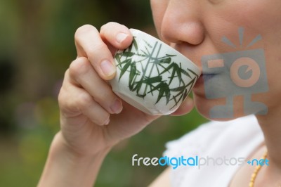 Asian Woman Drinking Tea Stock Photo
