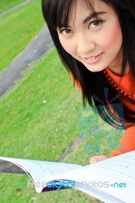 Asian Woman Reading Stock Photo