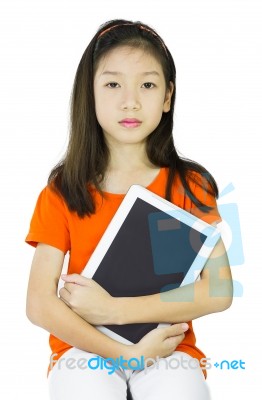 Asian Young Girl Is Holding Tablet Stock Photo