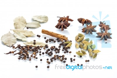 Assorted Exotic Spices On White Background Stock Photo