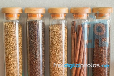 Assortment Of Spices In Glass Bottles Stock Photo