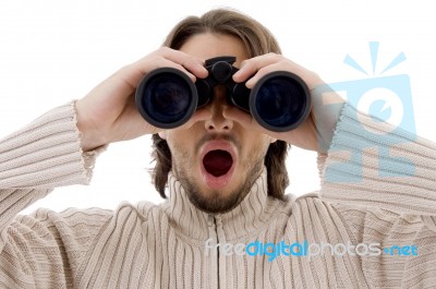 Astonished Male Watching Through Binocular Stock Photo