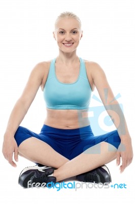 Athletic Woman Sitting And Resting Stock Photo