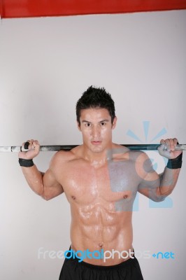 Athletic Young Man Doing Workout With Weights Stock Photo