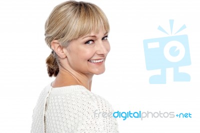 Attractive Female Turning Back And Smiling At You Stock Photo