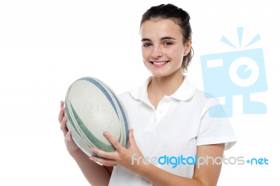 Attractive Sporty Girl Posing With Rugby Ball Stock Photo