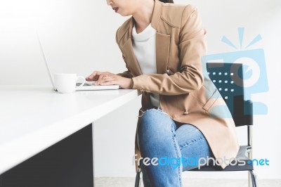 Attractive Women In Casual Business Sitting At A Table Working O… Stock Photo