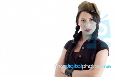 Attractive Young Female Posing With Her Arms Crossed Stock Photo