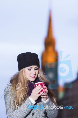 Attractive Young Stylish Blonde Girl Drinks Hot Drink From A Mug… Stock Photo