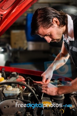 Auto Mechanic Fixing Car Engine Stock Photo