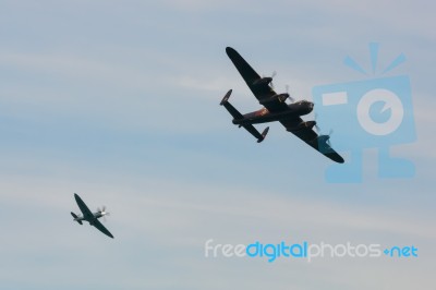 Avro Lancaster And Spitfire Mk1 At Airbourne Stock Photo