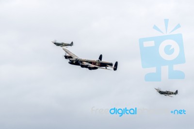 Avro Lancaster Flanked By Two Spitfires Stock Photo