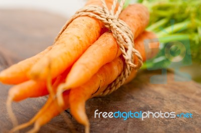 Baby Carrots Bunch Tied With Rope Stock Photo