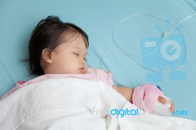 Baby Have Diarrhea And Sleep On A Bed In Hospital With Saline In… Stock Photo