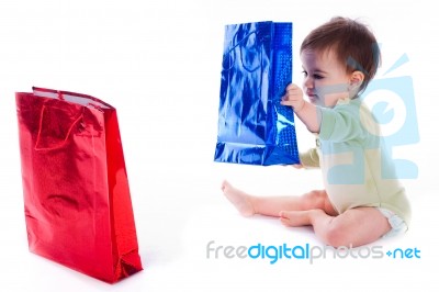 Baby Holding The Shopping Bag Stock Photo