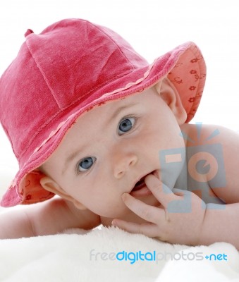 Baby In Red Hat Stock Photo
