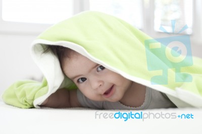 Baby Under Blanket Stock Photo