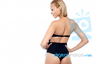 Back Pose Of A Young Fashion Model Stock Photo