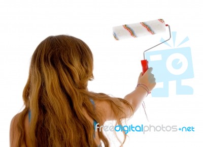 Back Pose Of Girl With Roller Brush Stock Photo