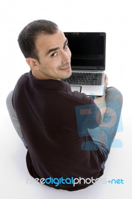 Back Pose Of Man With Notebook Stock Photo
